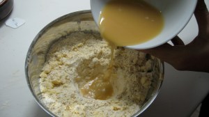 Make a well in the flour and oats and pour the maple syrup and buttermilk mixture