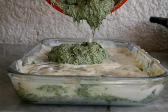 adding the spinach and cheese filling